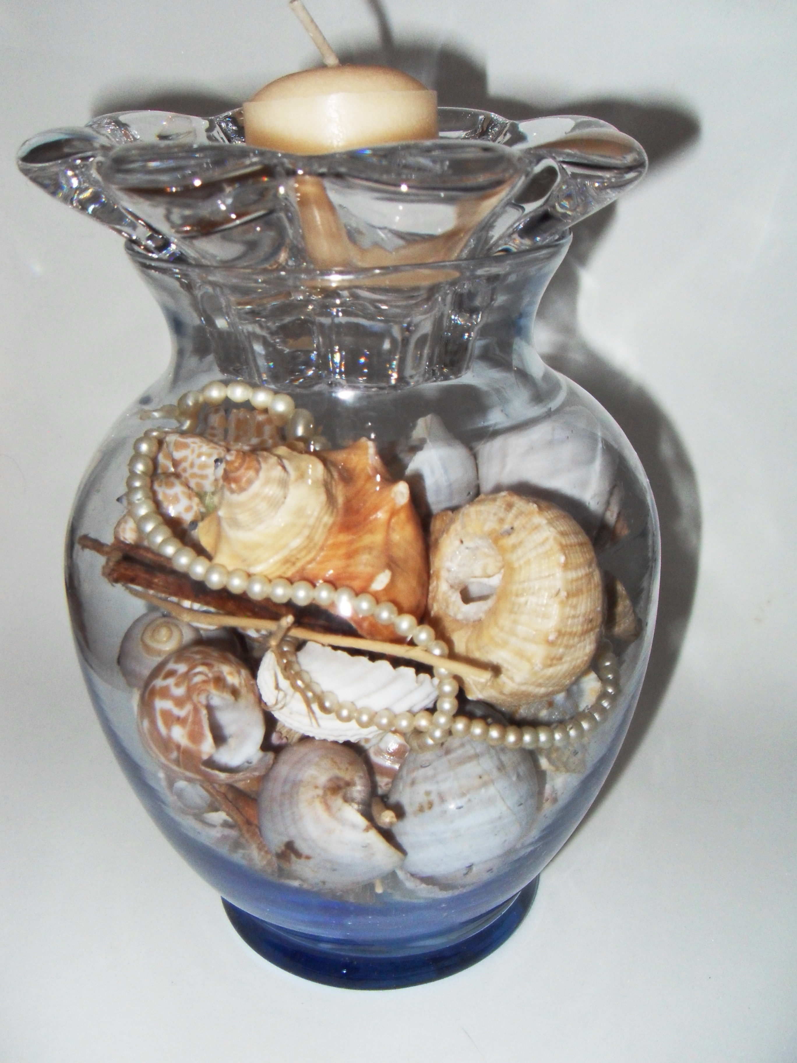 Votive/vase with Sea Shells and Pearls Centerpiece